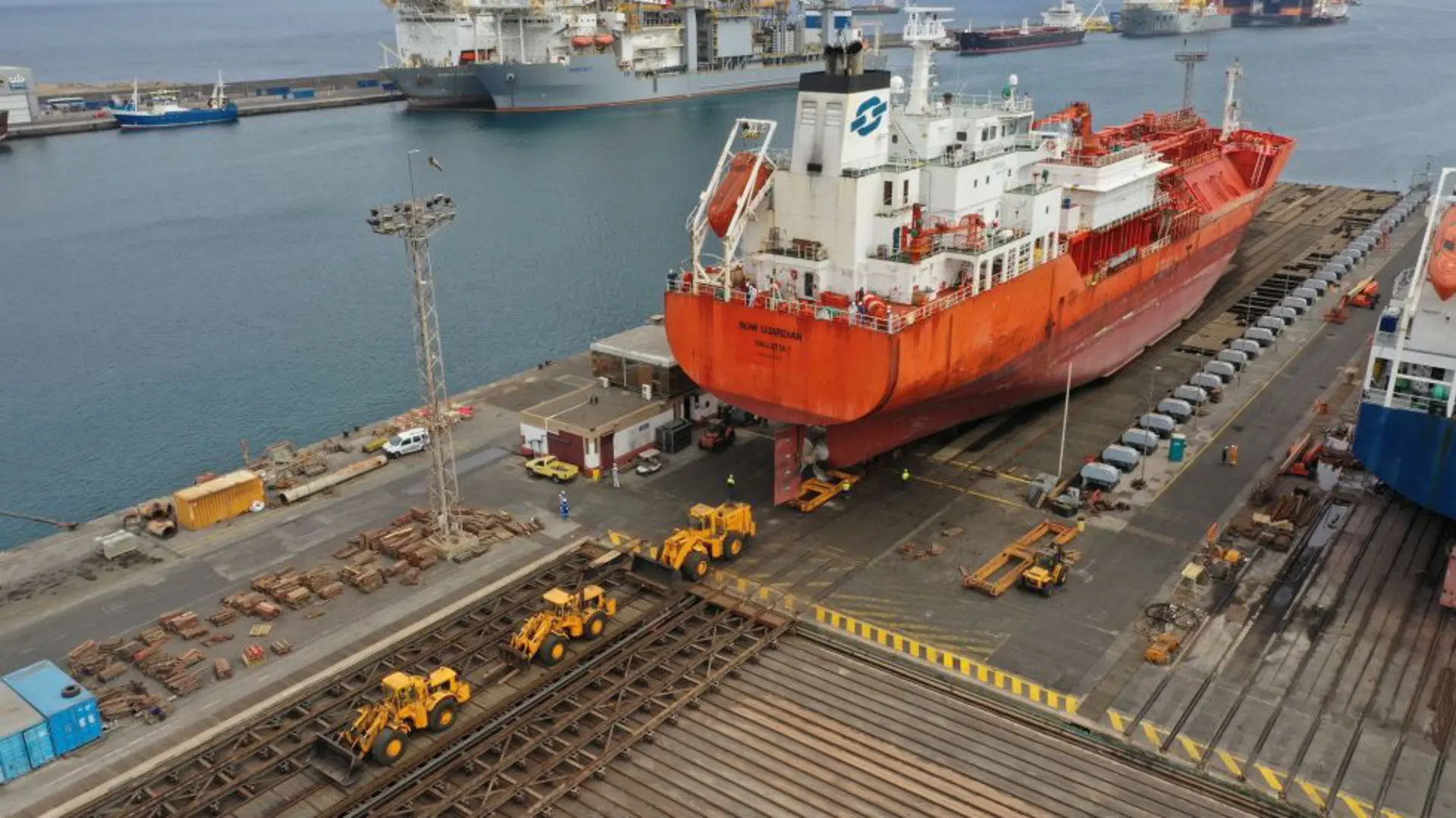 Ship being hauled by dozers from the syncrolift shiplift to the transfer system at Astican Shipyard
